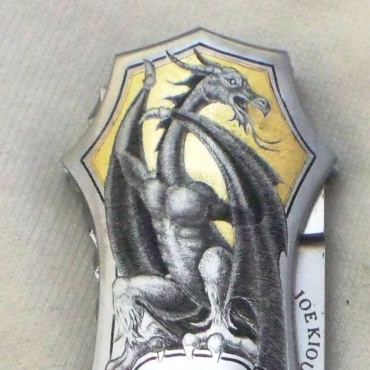 Knife bolster — dragon engraving, gold shield, close crop