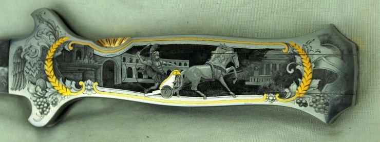 Knife blade — Roman charioteer, colosseum, gold laurel border